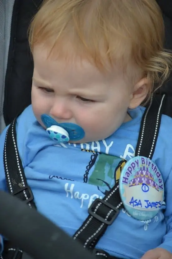 Child wearing Disney World celebration button