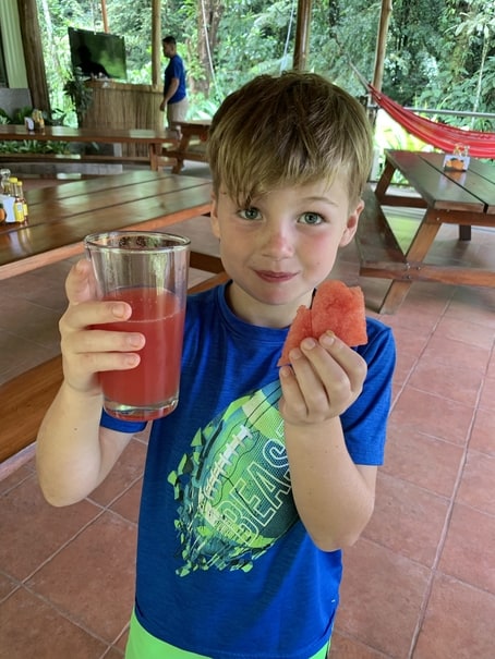 Boy eating watermelon and juice in Costa Rica