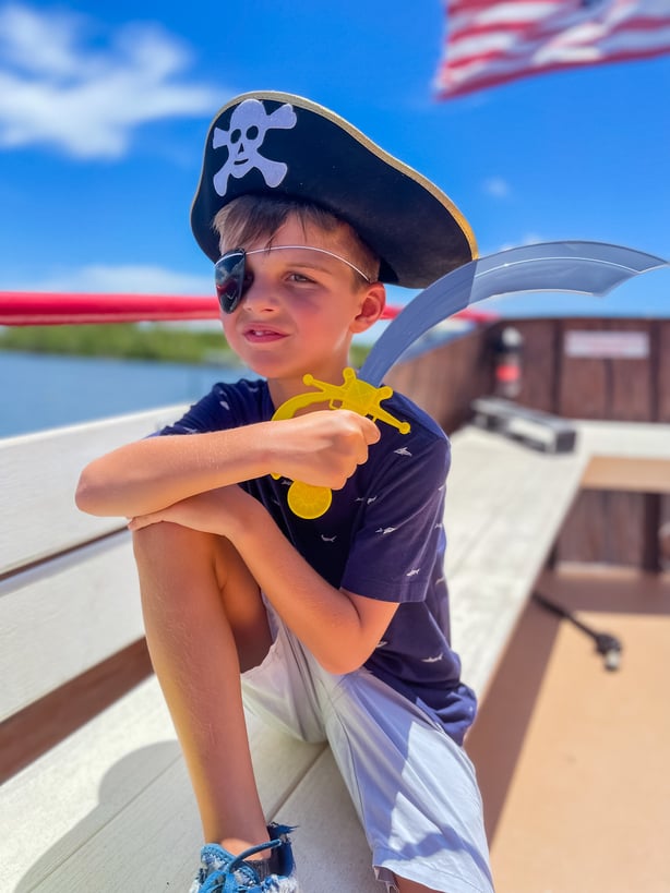 child wearing Captain Kid gear from All Ages pirate cruise fort myers