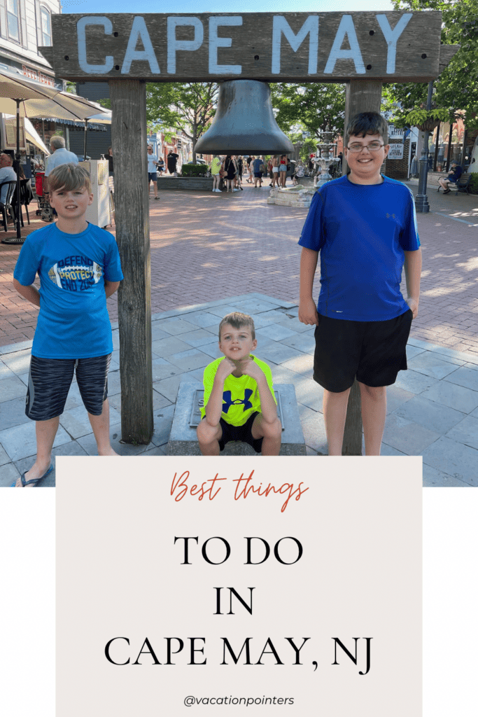 Best things to do in Cape May, NJ. Three boys standing under the Cape May sign and bell